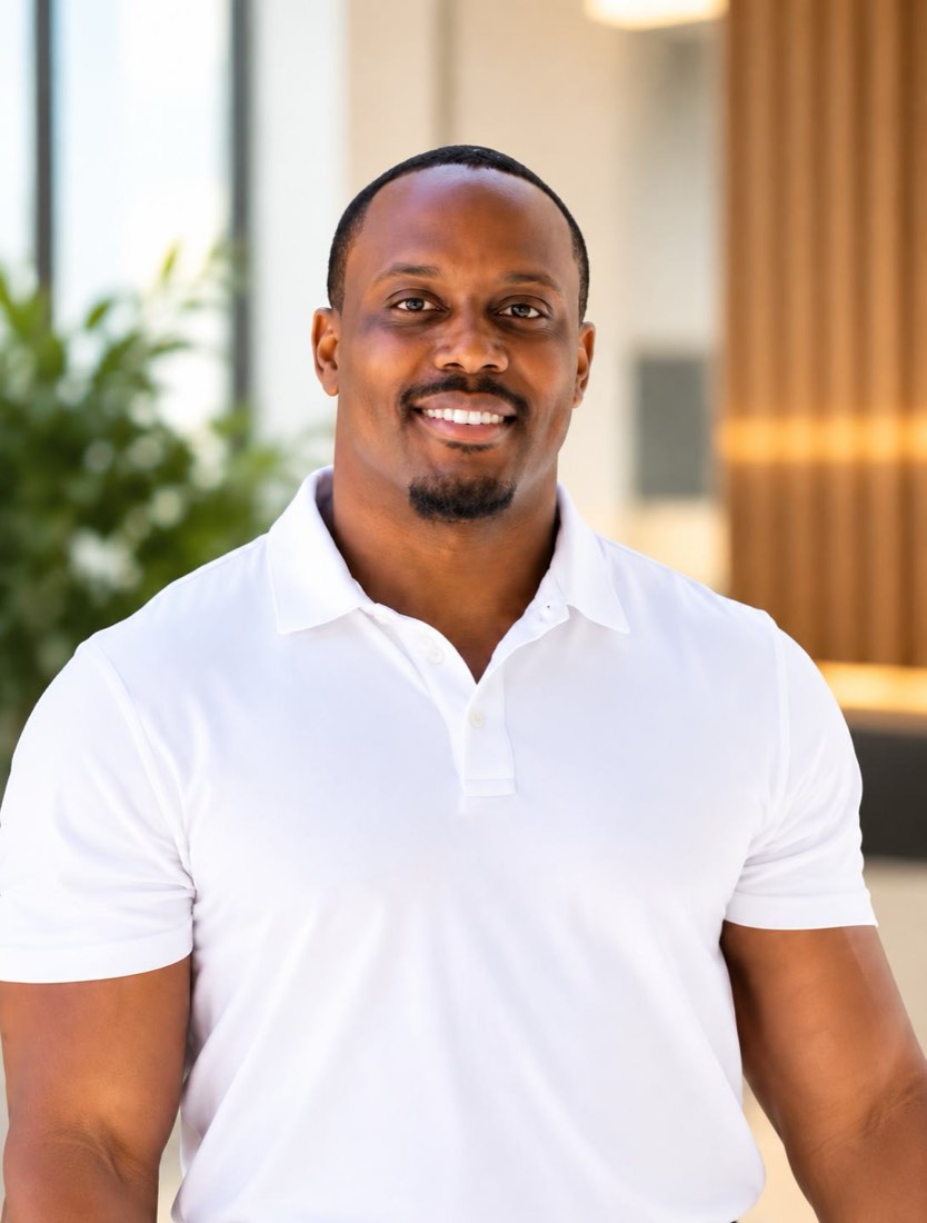 Jordan Blackmon, founder of Blackmon Tutoring, smiling in an office lobby